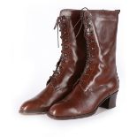 A pair of Hermes brown leather boots, modern, with lace up front, in original box,