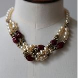 Chanel jewellery, comprising: faux pearl and red bead knotted choker necklace, 41cm, 16in long,