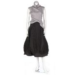 An Issey Miyake pleated polyester ensemble, probably 1990s, black on silver woven label,