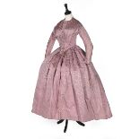 A mauve damask silk day dress, mid 1840s, with radiating pleats from low V shaped waist,