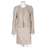 A Chanel pale pink cotton tweed suit, 2005, flecked with gold metallic threads,