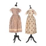 Three printed cotton girl's dresses, 1830s-60s,
