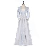 A pale blue cotton summer dress, 1905-10, with raised couched strapwork and blue embroidery,