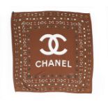 A Chanel silk scarf printed with sautoirs and logo, modern, signature to one corner, 85cm square,