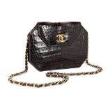 A Chanel brown alligator bag, 1980s, alligator mississippiensis, with gilt clasp and chain,