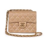 A Chanel quilted beige leather bag, 1990s, stamped to interior, with authentication card no 3549163,