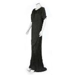 A Mariano Fortuny black pleated silk Delphos gown, 1920-30, signed to left shoulder selvedge,