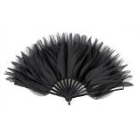 A rare Chanel black organza fan, 1920s-30s, with black celluloid sticks and guards,