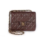 A Chanel quilted brown leather bag, 1990s, stamped to interior, with authentication card no 4355356,