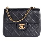 A Chanel quilted navy leather bag, 1990s, stamped to interior, with authentication card no 2724973,