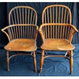 A pair of Yew and elm Windsor carver chairs 19th century