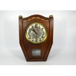 An Art Nouveau Jugendstil wooden pendulum wall clock