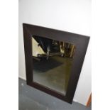 A modern leather framed mirror