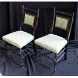 A pair of Aesthetic ebonised bedroom chairs