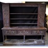 A Georgian oak Welsh dresser with possibly later carving