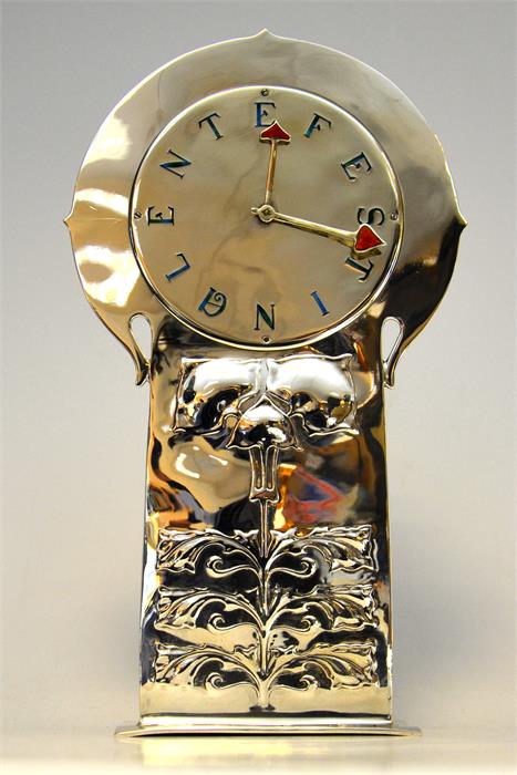 A silver arts & crafts clock designed by Archibald Knox for Liberty & Co.