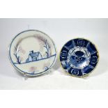 Two Delft plates, one a Dutch Delft 'Peacock' plate, one a tin glazed Delft earthenware plate