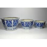 A tray lot of three blue and white ceramic planters.