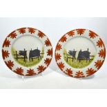 A pair of primitive hand-painted plates,