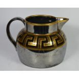 A 19th century brown lustre jug with greek key design