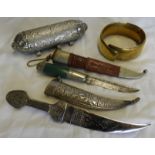 BRASS BRACELET, 2 KNIVES IN SCABBARDS & PENDANTS