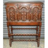 EARLY CARVED OAK CABINET ON STAND