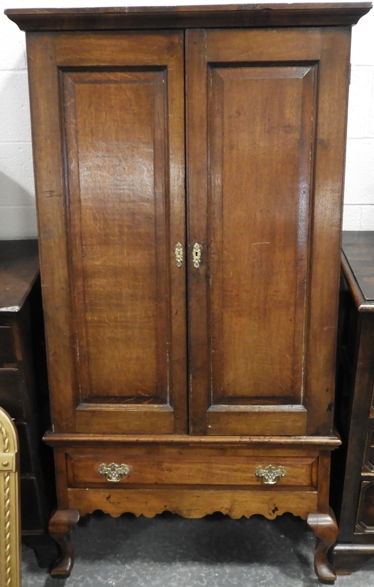 OAK 2 DOOR CUPBOARD WITH FREIZE DRAWER ON CABRIOLE LEGS 69'HX35'W