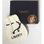 LIBERTY £10 TOKEN IN PURSE