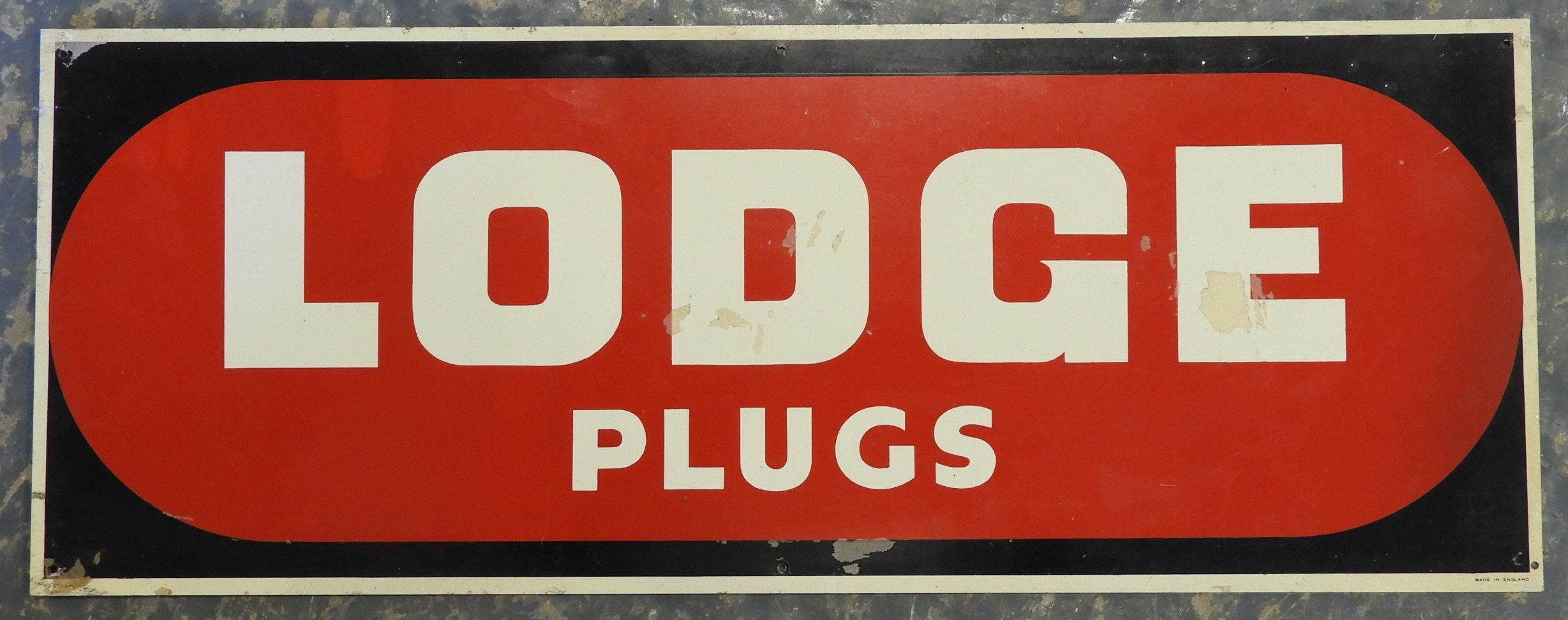 TIN SIGN LODGE PLUGS 24' X 9'