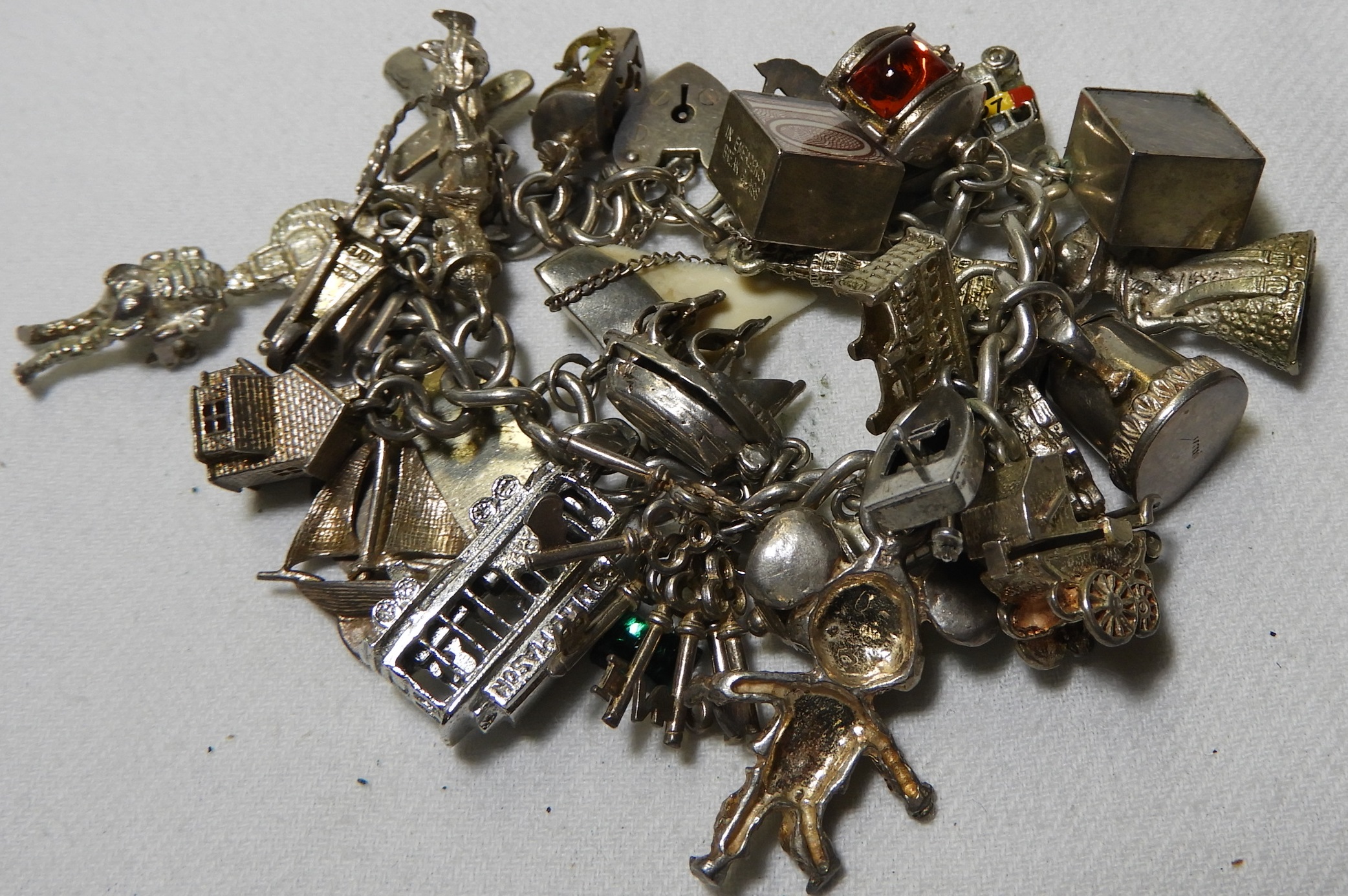 SILVER PADLOCK CLASP CHARM BRACELET WITH 25 CHARMS