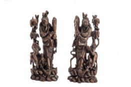 Paar Kultfiguren, China um 1900 Hartholz, vollrund geschnitzt mit feinem Silberdraht touchiert.