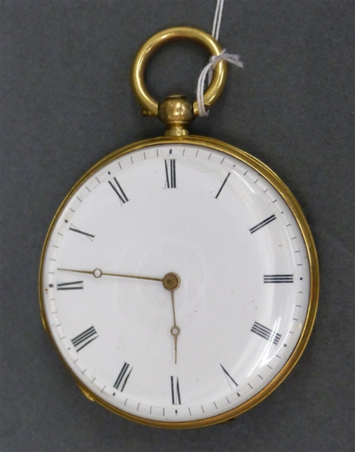 Taschenuhr 14 kt. Gelbgold, Schlüsselaufzug, defekt, weißes Emailzifferblatt, Gehäuse beschädigt,