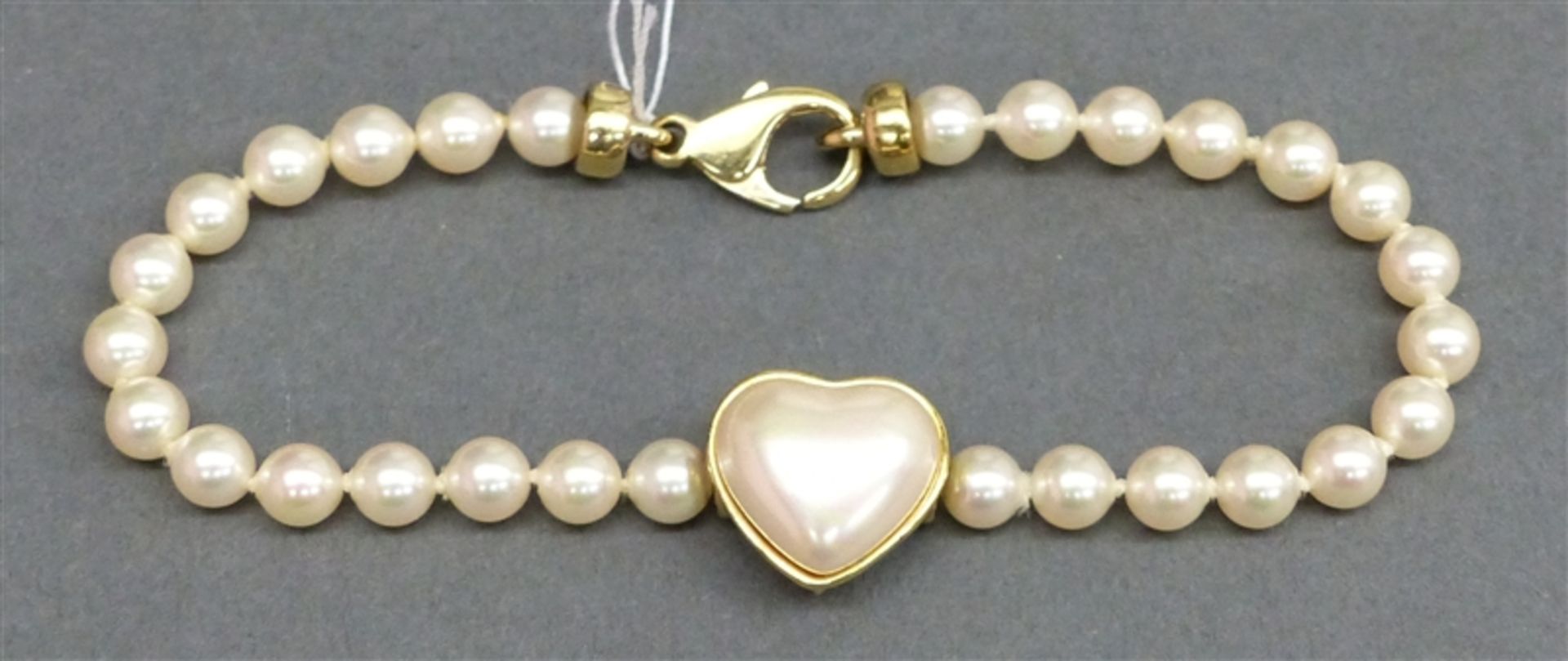 Armband 925 Silbermontur, mittig herzförmige Perle, 30 Zuchtperlen, Verschluss vergoldet, l 18,5