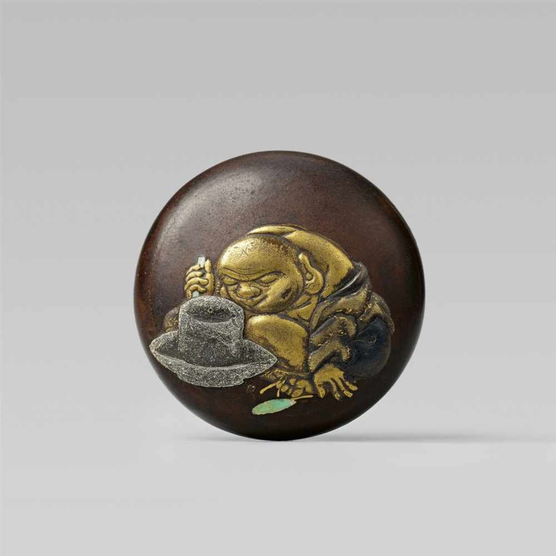 A wood and maki-e lacquer two-part manjû with a monk by a tea grinder, by [...]