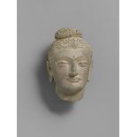 Kopf eines Buddha. Grauer Schist. Pakistan, Gandhara. 2./3. Jh. Ebenmäßige Züge mit großen,