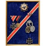 Framed Personal Group of 4 Decorations, 3 Badges and Ribbon Bar German Cross in Gold, Iron Cross 1st