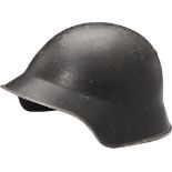 Fireman Helmet, 1950-1980 Made in steel painted black. Paint: 95% of the surface. Leather liner