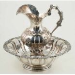 Embossed silver basin and pitcher. Barcelona. Circa 1800. Marks: Junyent and BR↵Total weight: 2.