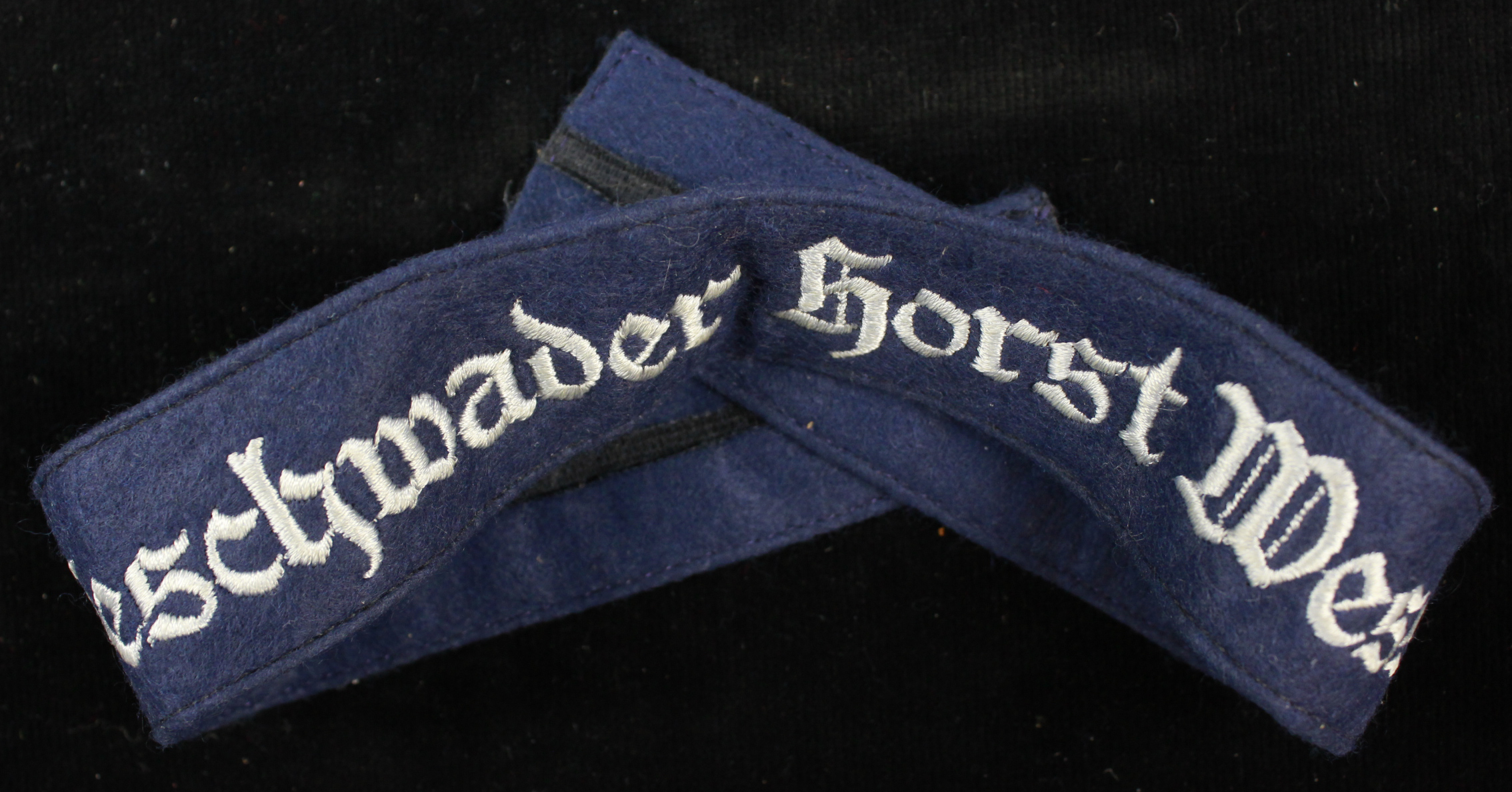 German Gesschwander Horst Wessell Luftwaffe cuff title full length. Grey on Blue. No service wear.