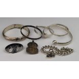 Mixed lot of silver jewellery comprising five bangles, silver bracelet, Siamese silver brooch and