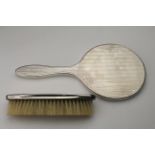 Britannia silver hand mirror & brush, by B.M.C., circa 1920s-30s, mirror length 26.5cm