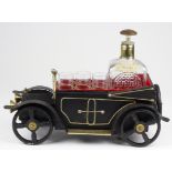 Novelty musical decanter, in the shape of a vintage motor car, with original decanter and three