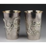 Chinese silver tumblers with large dragon design both marked "WH90" for Wang Hing & Co. of Hong Kong