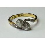 18ct Gold/Plat. Ring with Crossover setting and 2 Diamonds approx 0.50ct weight size K weight 2.7