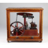 Large Stuart live steam model, red with yellow painted detailing, contained in four glass mahogany