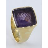 Yellow metal (tests as 14ct Gold) Amethyst seal Ring size O weight 11.5 grams