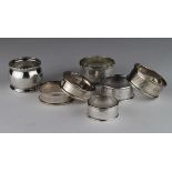 Seven silver napkin rings, includes a silver continental napkin ring marked 835.Various dates. Total