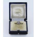 18ct White Gold Ring with central 0.20 ct weight Diamond in a Floral Diamond surround size L