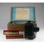 Magic lantern by Georges Carette & Co., circa 19th century, including ten glass slides, contained in
