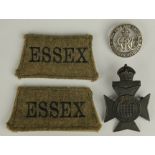 Badges - a Silver War Badge 244525, 16th County of London hat badge, and a pair a khaki 'Essex'